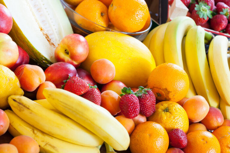 Many ripe fruits at table in domestic kitchen  at home